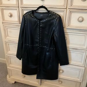 Cabi pleather jacket with studded hardware adorning the edges.